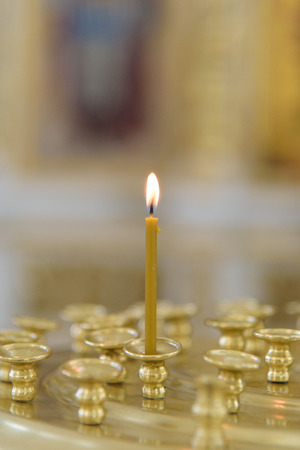 Burning Candle in Russian Orthodox Churchの写真素材