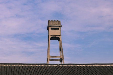 Tower of an old building with blue sky in the background.の写真素材