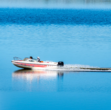 Boat on the water in the lake, blue sky background.の写真素材