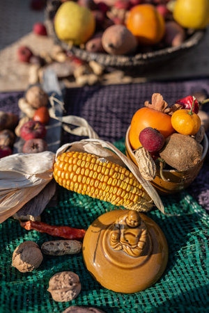 Autumn still life with fruits and vegetables on a wooden table.