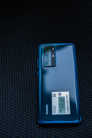 Close-up of a blue power bank on a black background.の写真素材