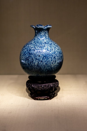 Chinese ancient porcelain vase on a wooden table, close upの写真素材