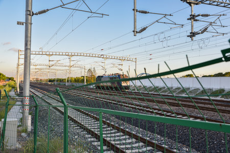 Railway station in the evening. Perspective view of railway tracks.の写真素材