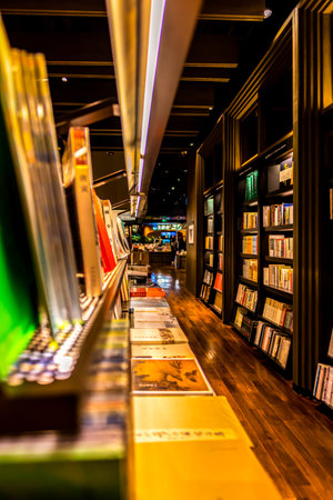 Bookshelf at night in the library of Bangkok, Thailand.の写真素材