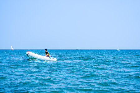 Man stand up paddle board in the sea with blue sky background.の写真素材