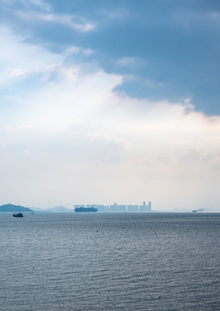 Boat in the sea with blue sky and cloud background.