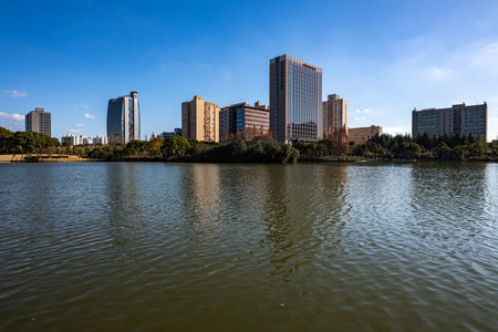 Landscape view of a lake with high-rise buildings in the backgroundの写真素材