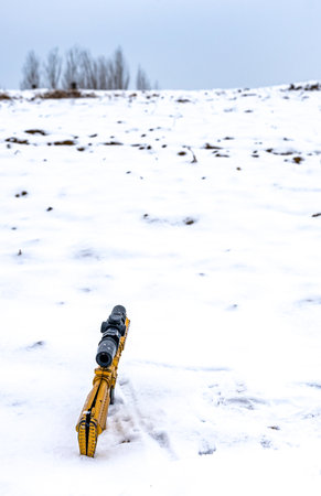 rifle on the snow in the winter, closeup of photoの写真素材