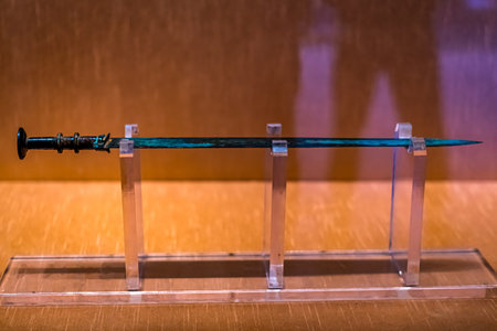 Ancient sword on the table in the museum. Selective focus.