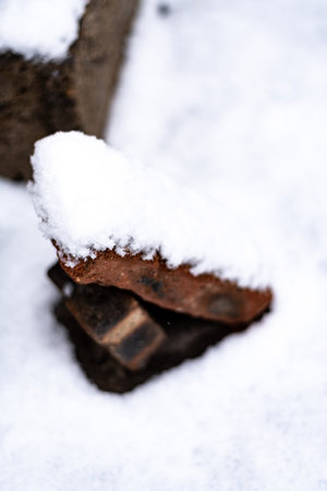Close-up of a rusty iron in the snow. Selective focus.の写真素材