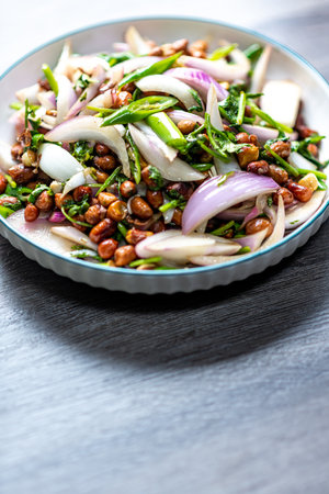 Spicy salad with pine nuts, red onions, arugula and walnutsの写真素材