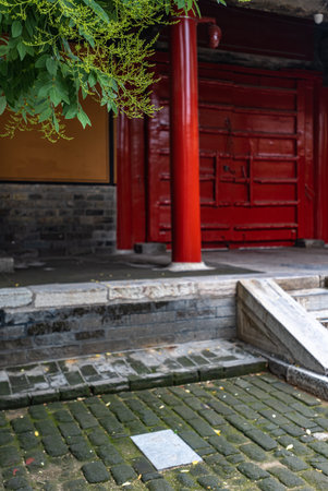 Stone stairs and red door in a Chinese temple in Shanghai, Chinaの写真素材