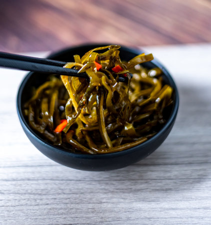 Korean food Seaweed salad in a bowl on wooden backgroundの写真素材
