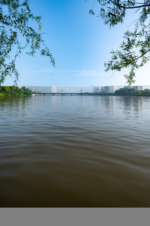 Lake and skyscrapers in Shenzhen, China. Shenzhen is the largest city in China.のeditorial素材