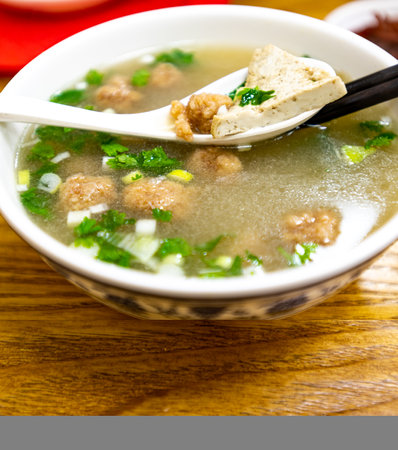 Vietnamese soup with meatballs and rice noodles in a bowl