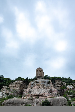 Buddha statue on the top of a mountain in China.