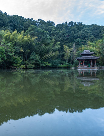 Landscape view of a pavilion in the middle of a lakeの写真素材