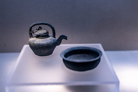 Kettle and teapot on displayの写真素材
