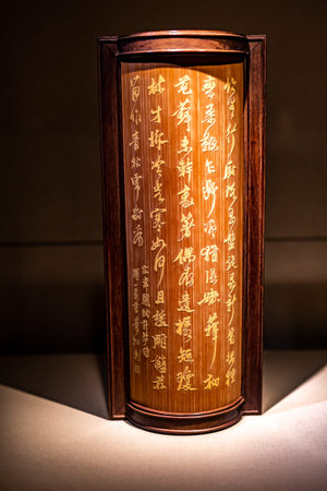 Lamp with Chinese hieroglyphs on the wall in the temple