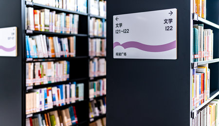 Bookshelf with books in a public library. Education concept.の写真素材