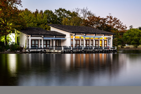 A view of a lake house in the middle of a lake.の写真素材