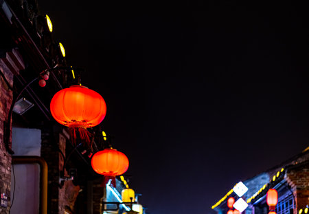 Red Chinese lanterns decorating the streets of London at night.の写真素材