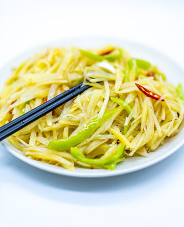 Green papaya salad with chopsticks on white background. Thai food