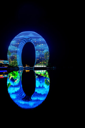night view of the city with reflection in the waterの写真素材