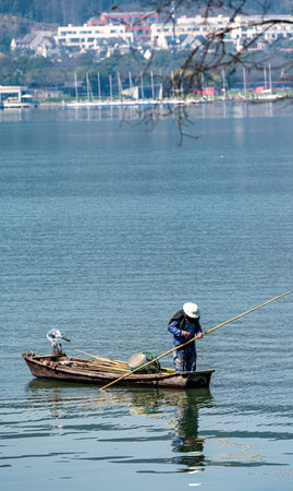 Fisherman on a boatの写真素材