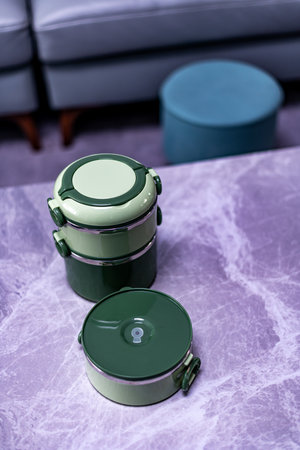 Three green containers on a marble table.の写真素材