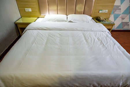 Double bed in a hotel room. Interior of a hotel room.の写真素材