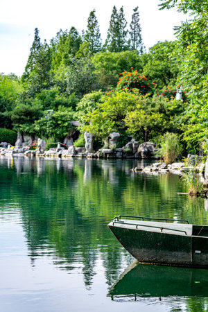 Beautiful Japanese garden with a boat on the lake in Kyoto, Japanの写真素材