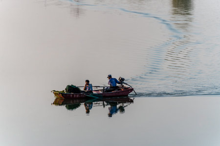 Fishermen in a boat on the Mekong River in Vietnam