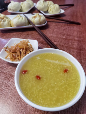 Chinese steamed dumpling soup with sweet potato dumplings