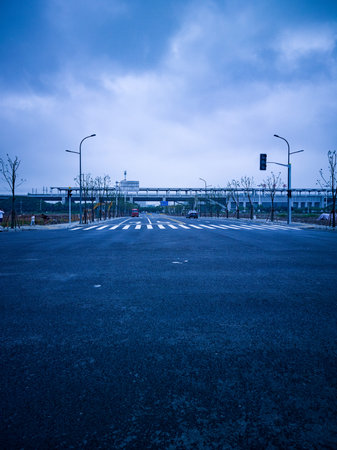 Asphalt road with blue sky and clouds.