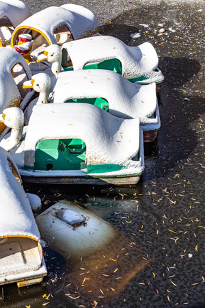 Frozen boats on a pier in the winter, closeup of photoの写真素材