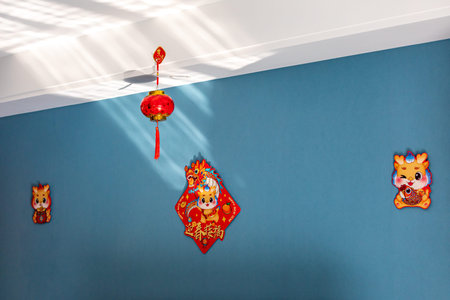 Chinese lanterns hanging on a blue wall in a Chinese temple.の写真素材