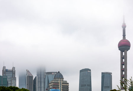 Shanghai world financial center skyscrapers and cloudy sky.
