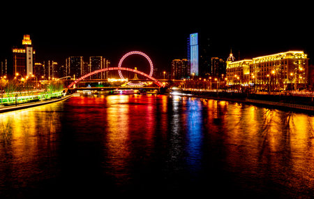 Night view of the bridge over the river in Shanghai, China.の写真素材