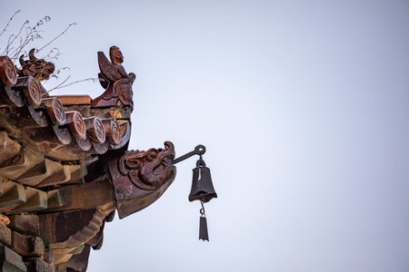 Bell on the roof of a Buddhist temple in Beijing, China.