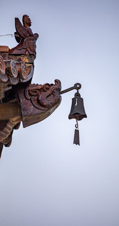 Buddhist statue and bell on the roof of the church.の写真素材