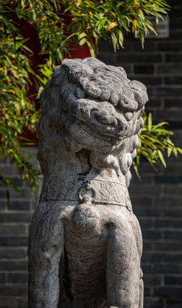 Stone lion sculpture in a park, closeup of photo, Chinaの写真素材