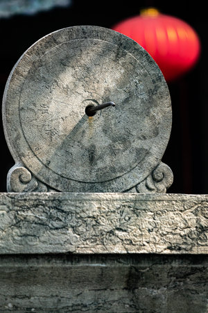 Ancient Chinese stone clock, closeup of photo with shallow depth of field
