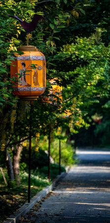Lanterns on the street in the park in the eveningの写真素材