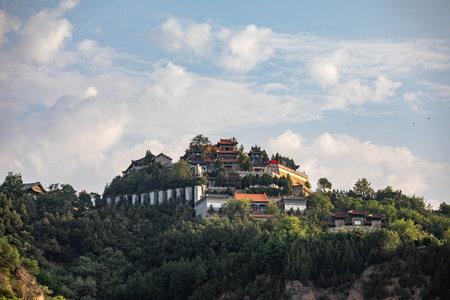 Buddhist monastery on the top of the hill in the mountainsの写真素材