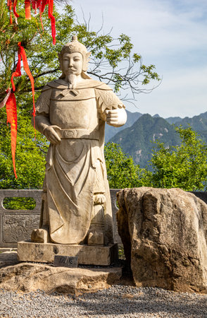 Statue of a Buddhist monk in the park, closeup of photoの写真素材