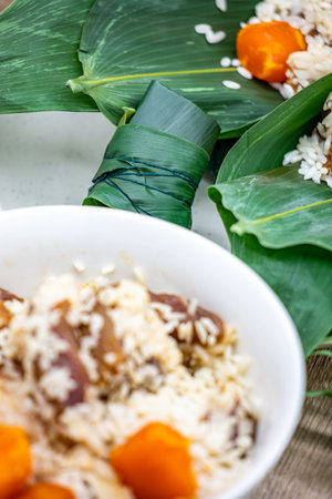 Porridge with rice and vegetables on a white plate. Thai food.の写真素材
