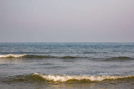 Beautiful sea landscape with waves on the seashore in summer
