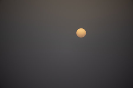 Moon in the sky at sunset, soft focus, natural background.の写真素材