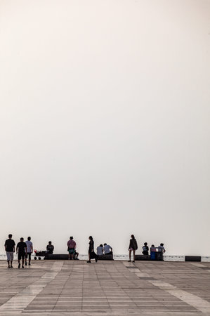 People at the beach in the early morning, Chonburi, Thailand